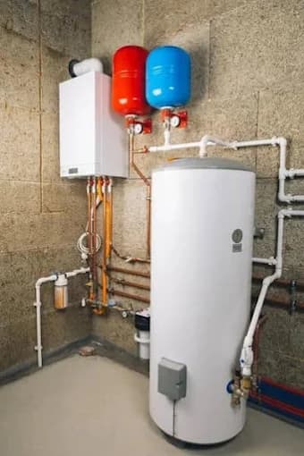 Central heating system with hot water cylinder, boiler and expansion vessels