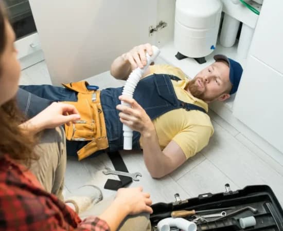 young-plumber-changing-trap-under-sink-1-1024x683
